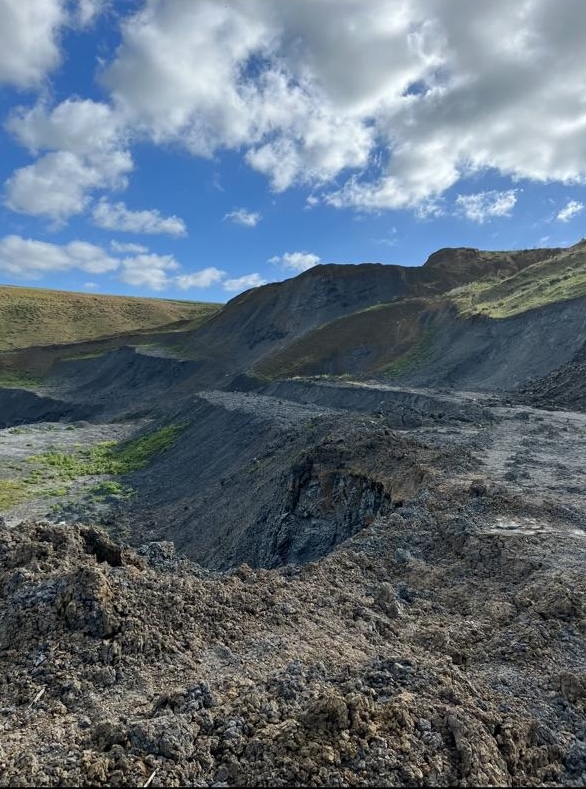 Clay quarry site at Menzel Bourguiba with exposed clay benches under a blue sky